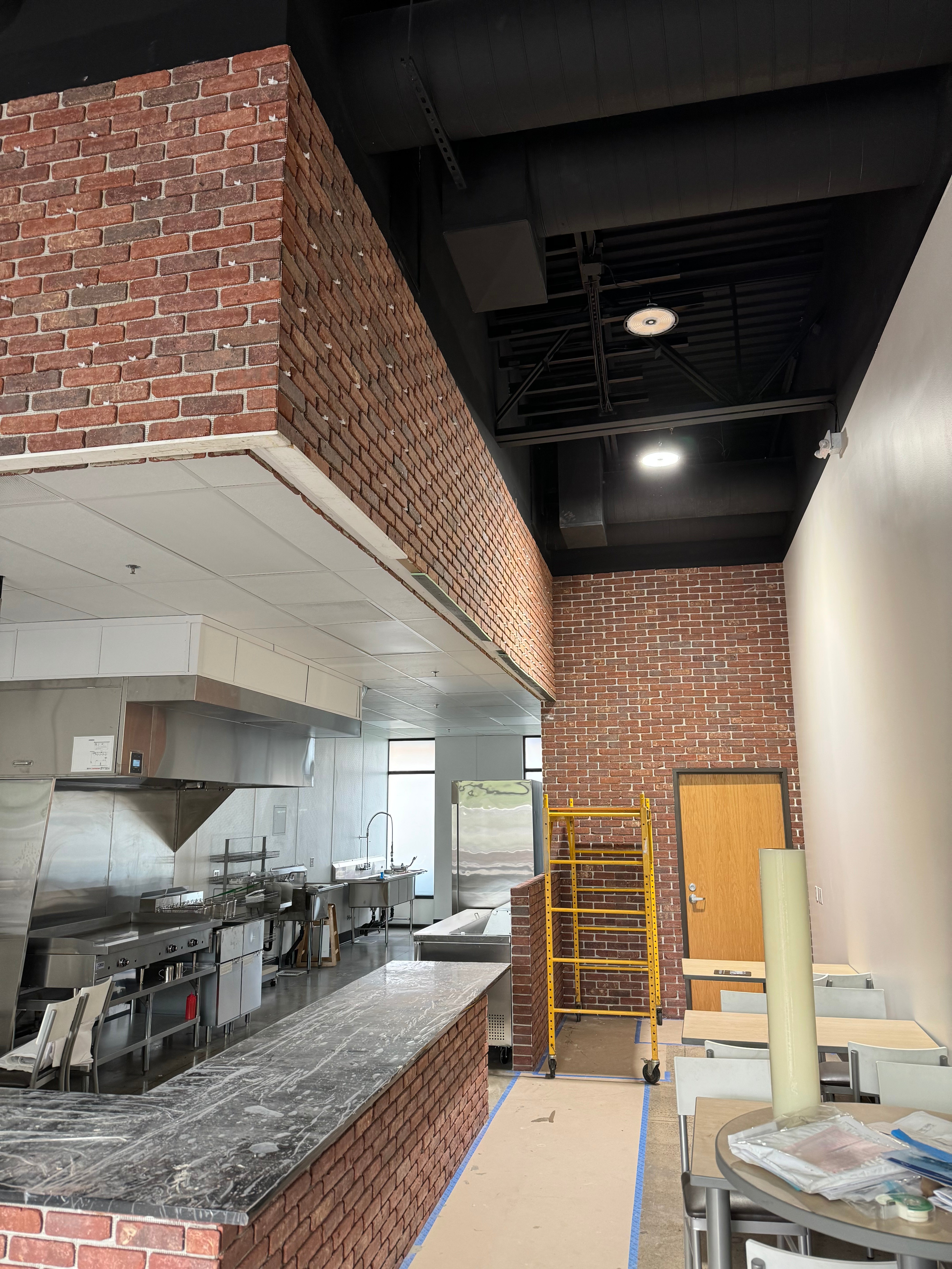 Commercial Kitchen with Brick Accents