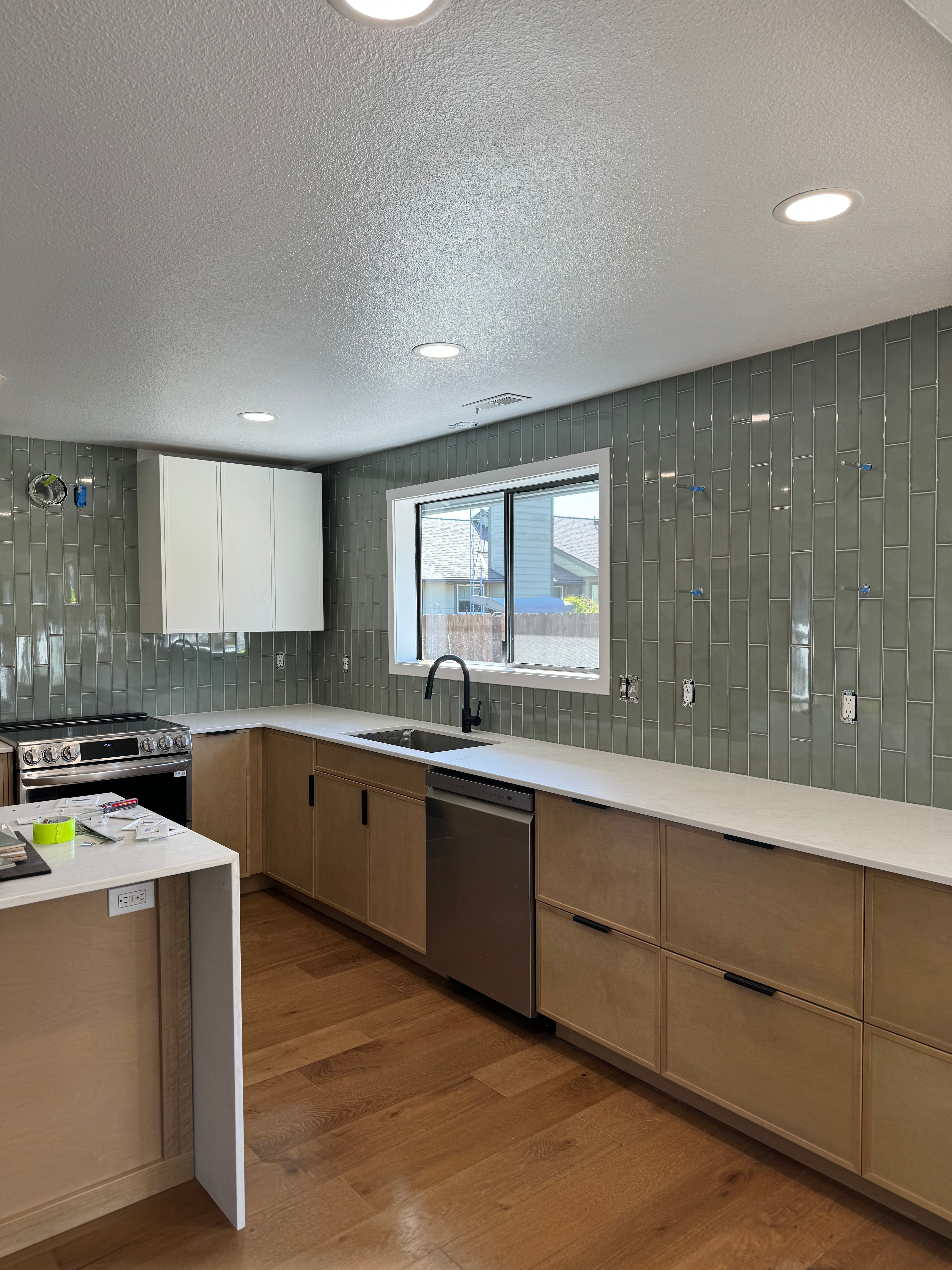 Modern Kitchen with Green Subway Tile